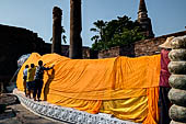 Ayutthaya, Thailand. Wat Yai Chai Mongkhon, 7m- long reclining Buddha, draped in a long orange robe.